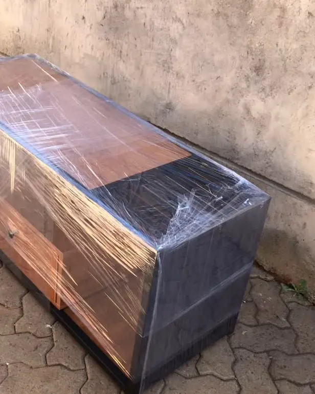 Finished TV stand wrapped for transport